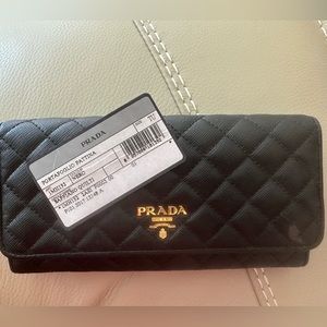 Authentic Black Prada wallet with gold hardware